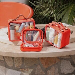 Calpak Medium Clear Cosmetics Case in Papaya